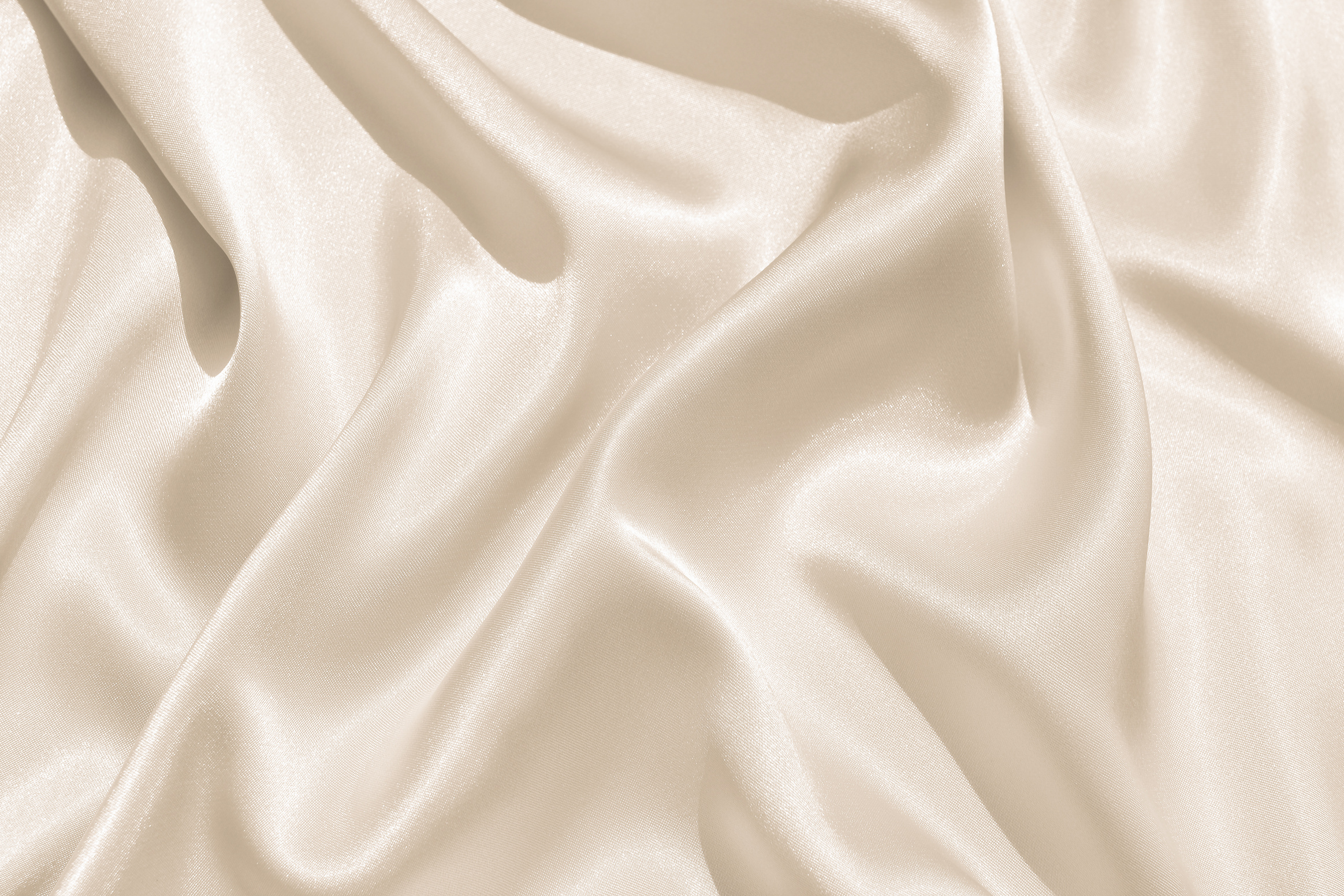 The texture of the satin fabric of beige color